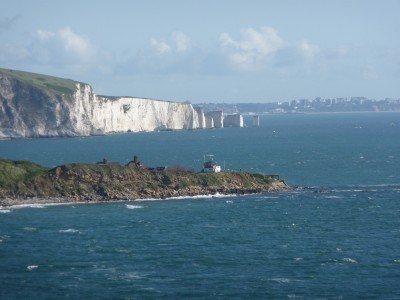 Image of Old Harries Rocks on a sunny day with a rough sea.