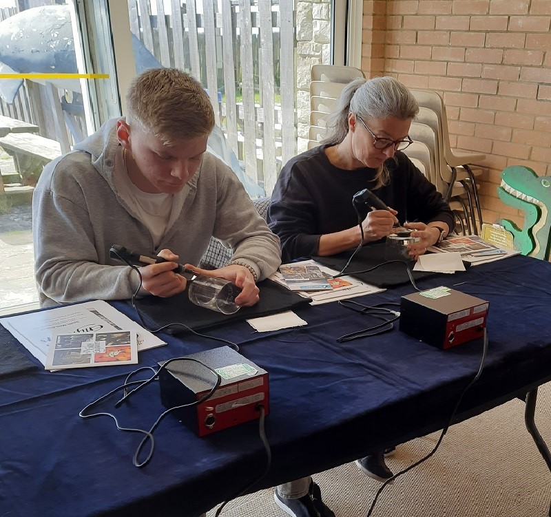 Two people attending a Glass Engraving Workshop 