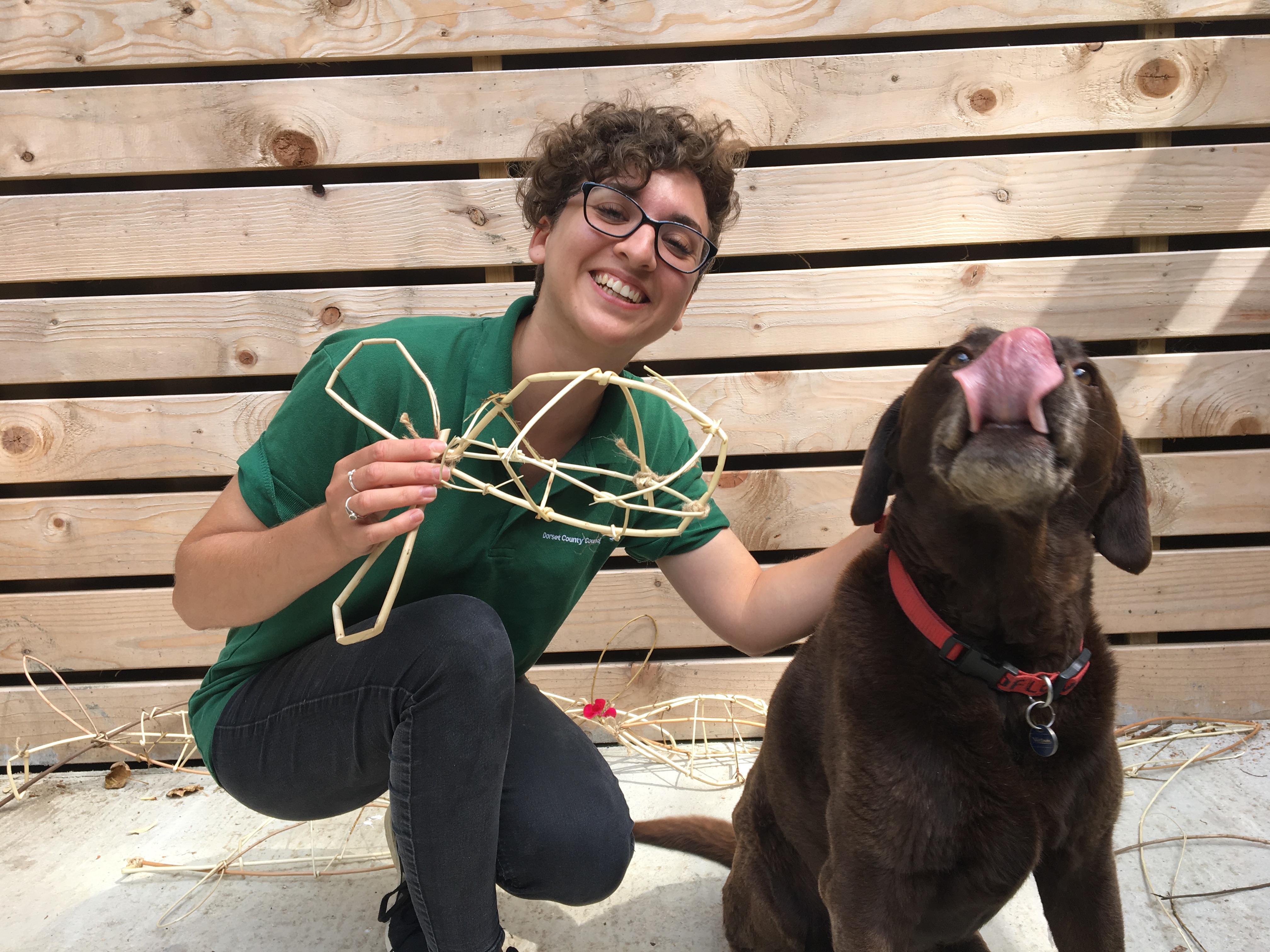 Ranger and dog with willow sculpture