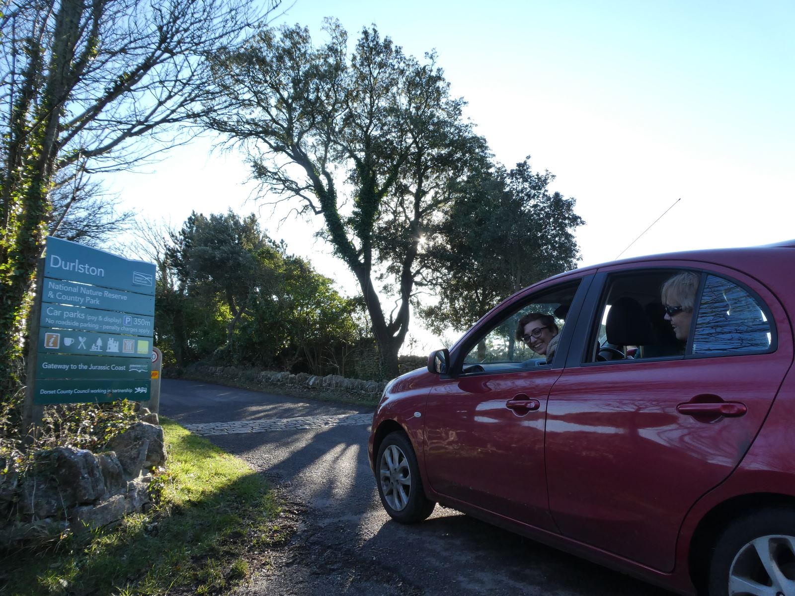 Car passing sign to Durlston 