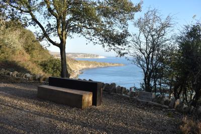 Viewpoint into the bay with a bench looking over the wall